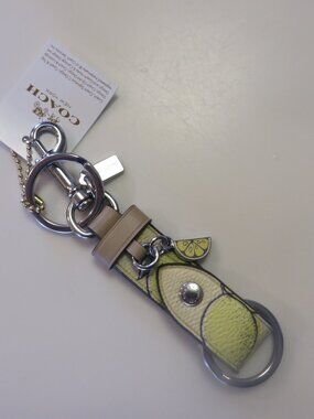 NWT Coach Trigger Snap Bag Charm with Lemon Print   Style  CAO47